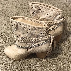 Suede booties w/rhinestone, braids & stud details w/ fringe & feathers on back.